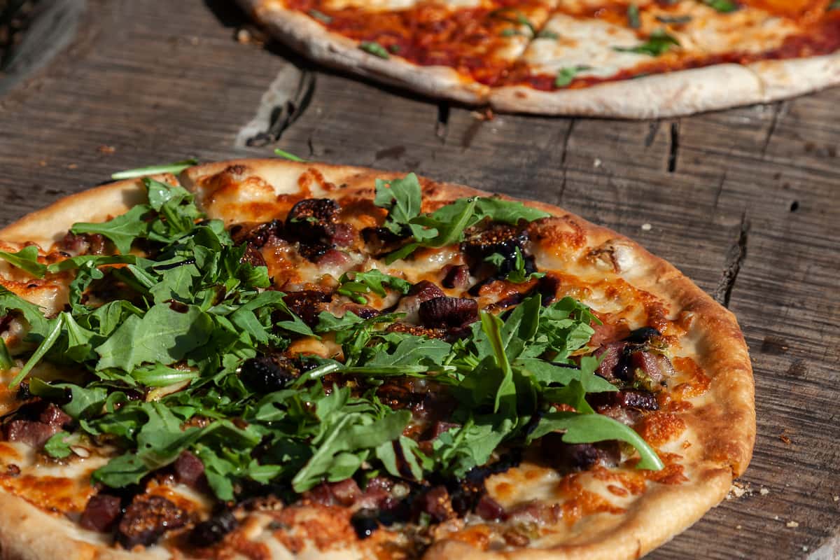 Pizzas on a wood board