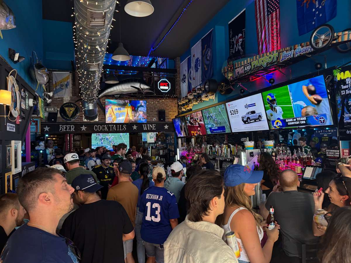 Crowd at Last resort watching football