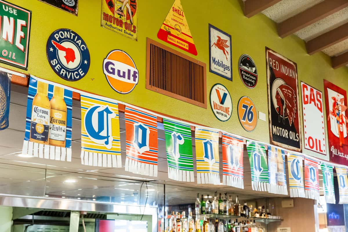 Restaurant inerior wall with multiple metal signs