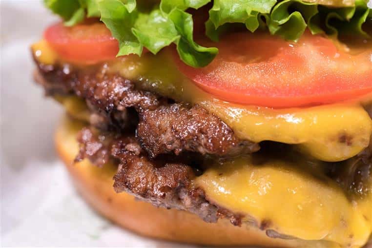 double cheeseburger with lettuce and tomato