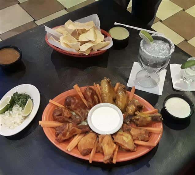 Wings, chips, tequila shot with lime, margarita