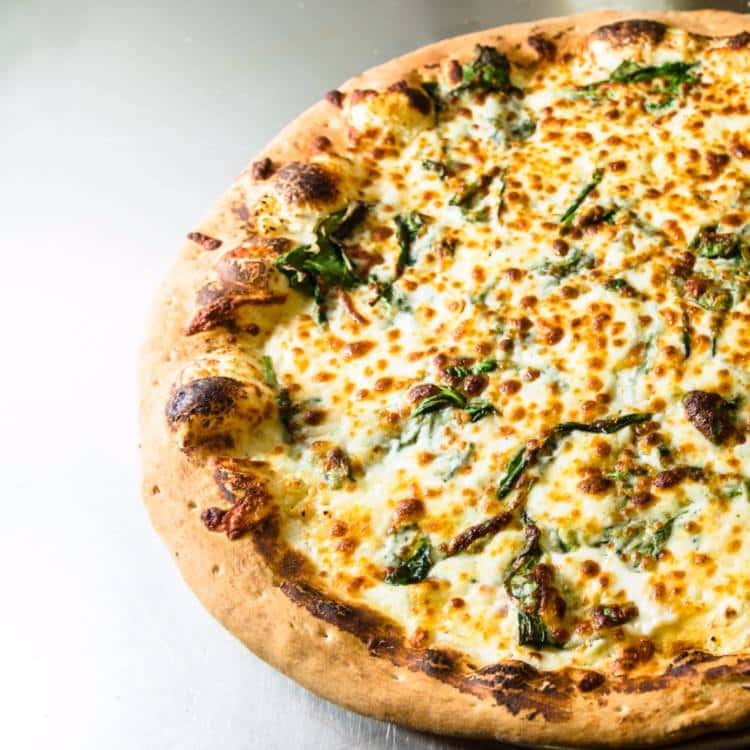 pizza with cheese and spinach