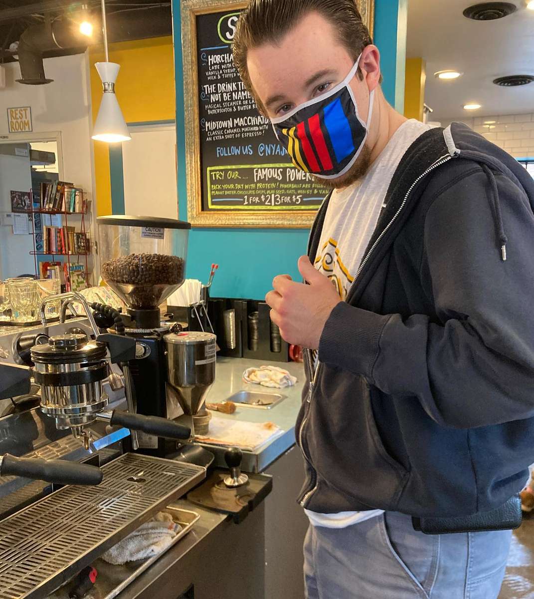 Brandon prepping coffee for the day