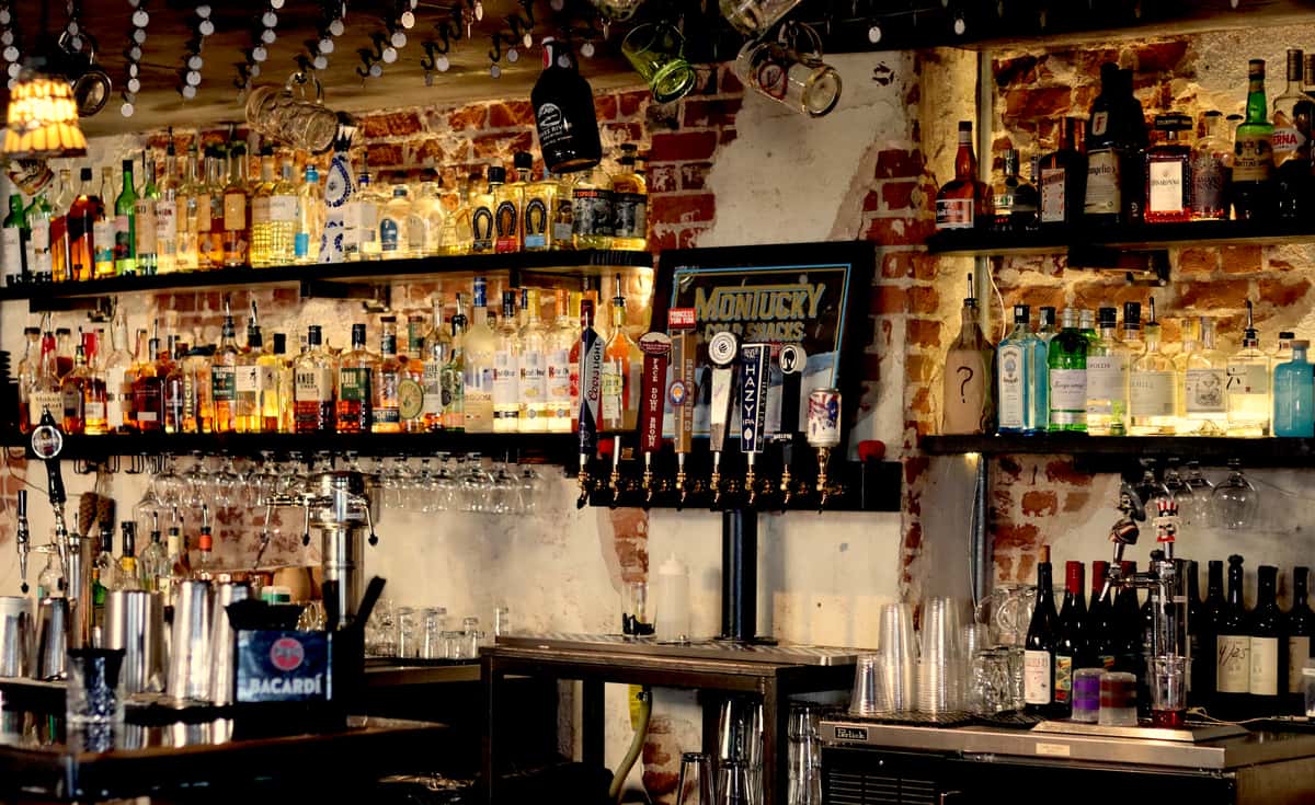 glass liquor bottles and beer taps