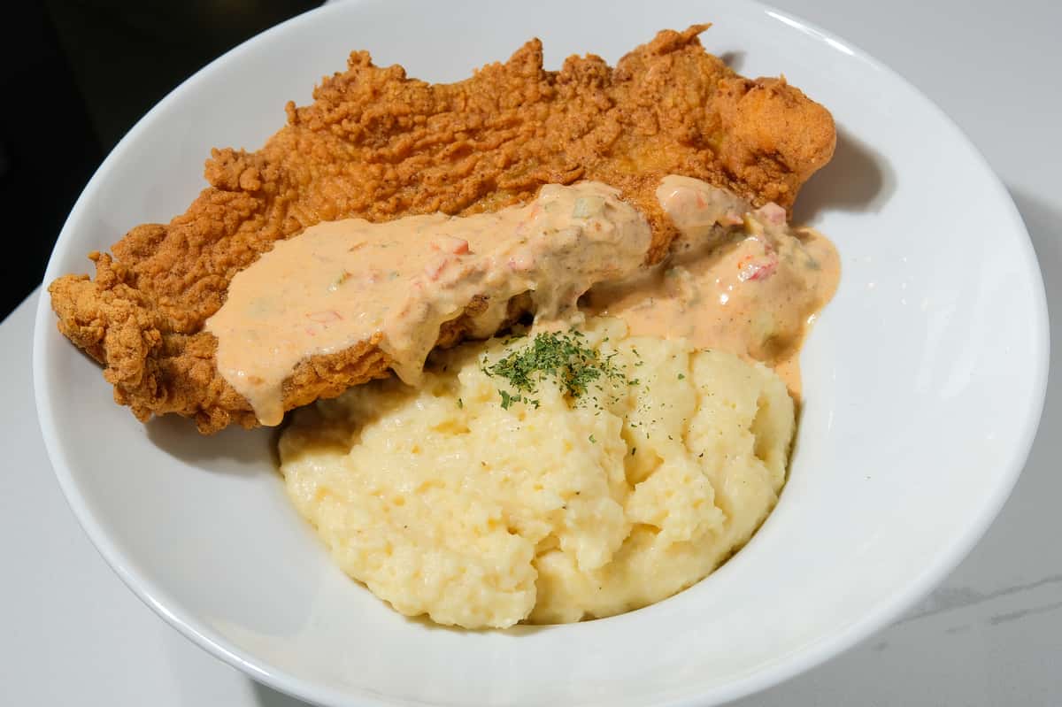 Classic comfort, done right 🍤✨ Our Catfish and Grits features perfectly seasoned, crispy catfish served over creamy, buttery grits — rich, flavorful, and satisfying in every bite. A true Southern favorite you don't want to miss 🤎 📍 732 Cherokee St NE, Marietta, GA 📞 (478) 304-8312