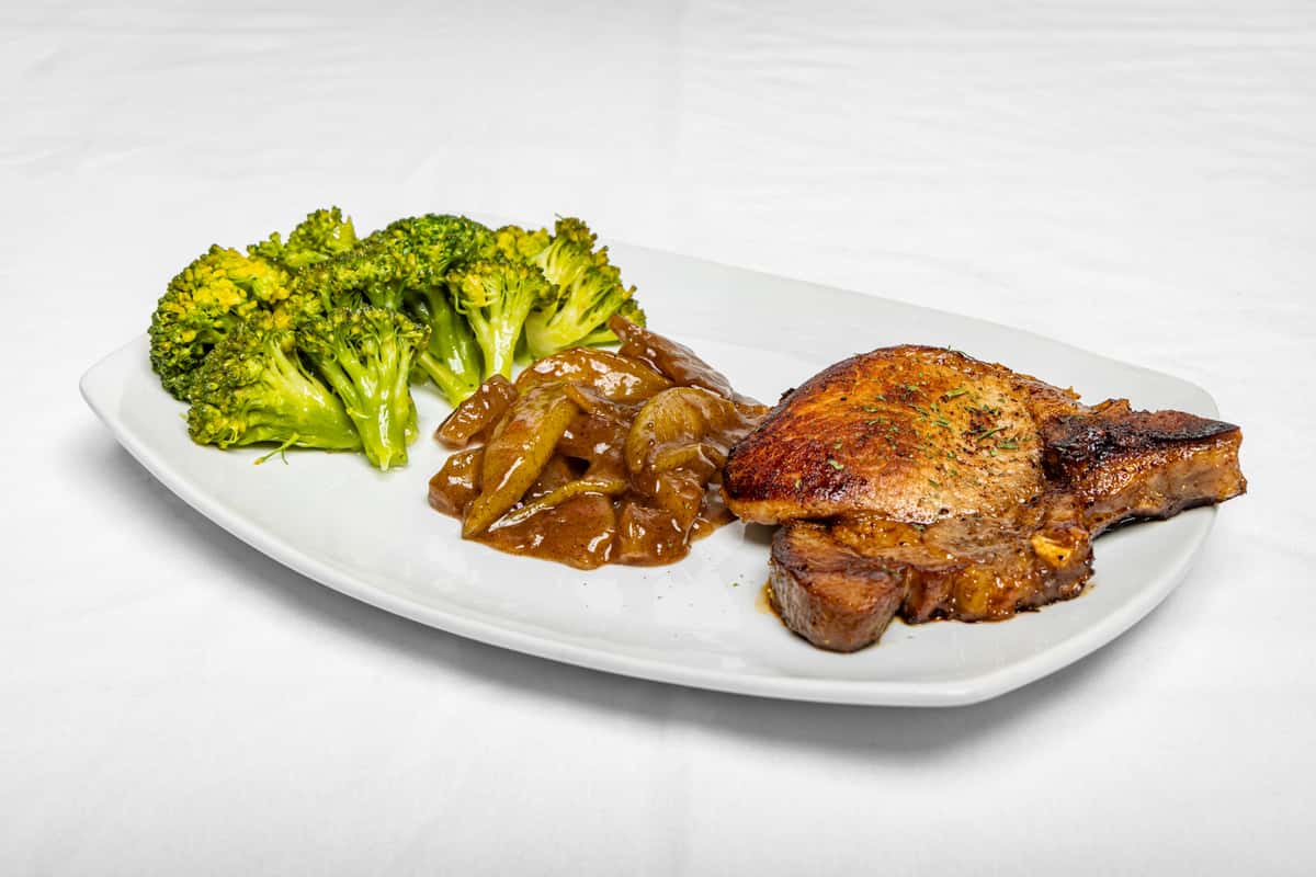 Juicy Pork Chop, done right 🔥🍖 Perfectly seasoned, cooked to perfection, and served fresh — comfort food at its best 💛 Available for dine-in, catering & private events 📍 Marietta 📲 dm 