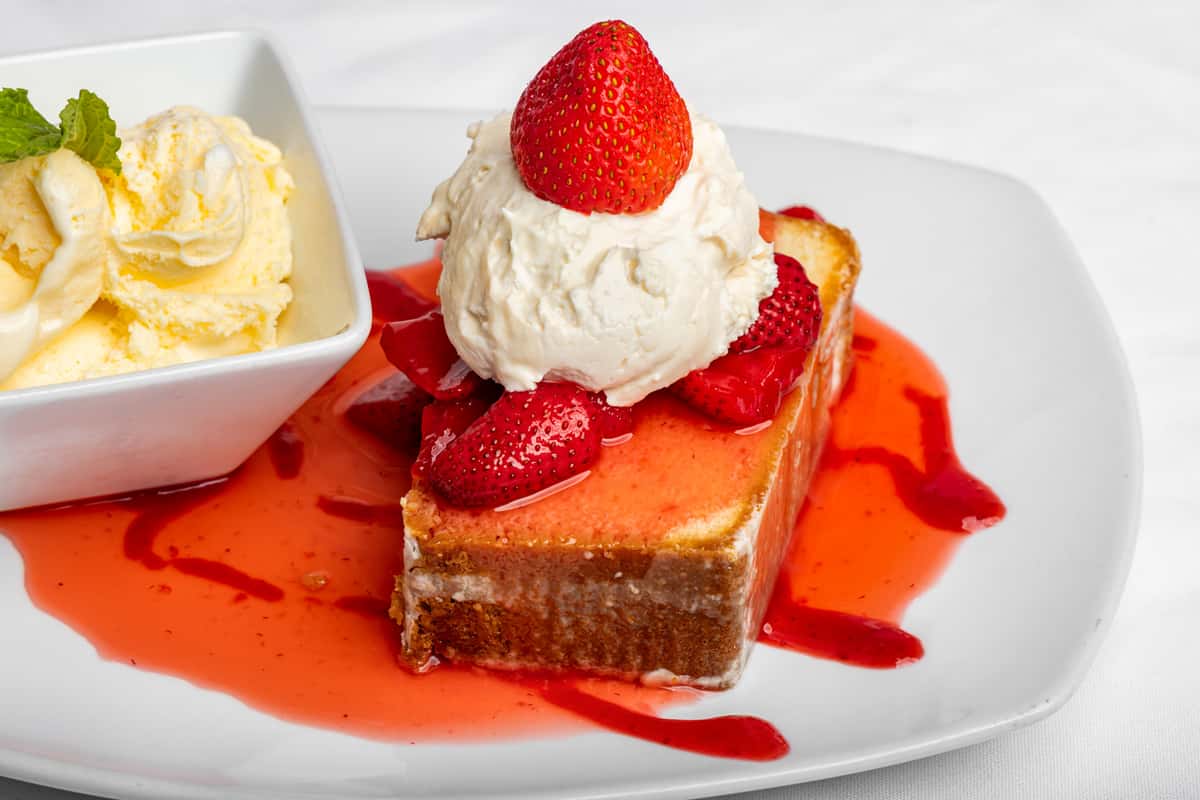 Fresh Strawberries in a fruity strawberry glaze, 1 honey biscuit and whipped cream made from scratch