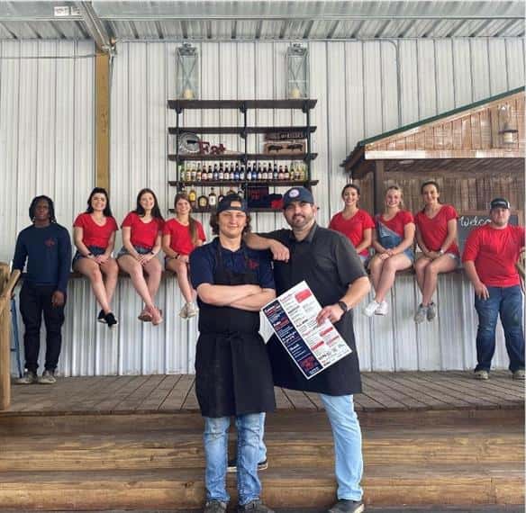 staff standing in front of the restaurant