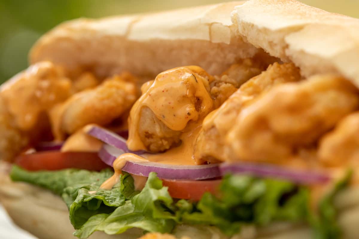 piled with lettuce ,tomatoes, onions and mayonnaise , stuffed with fried or grilled shrimp/ oyster whatever your choice - po'boys are slathered with our signature sauce and served on a toasted sub bread