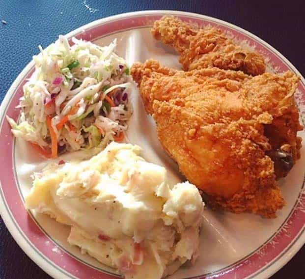 plate of fried chicken with mashed potatoes and coleslaw