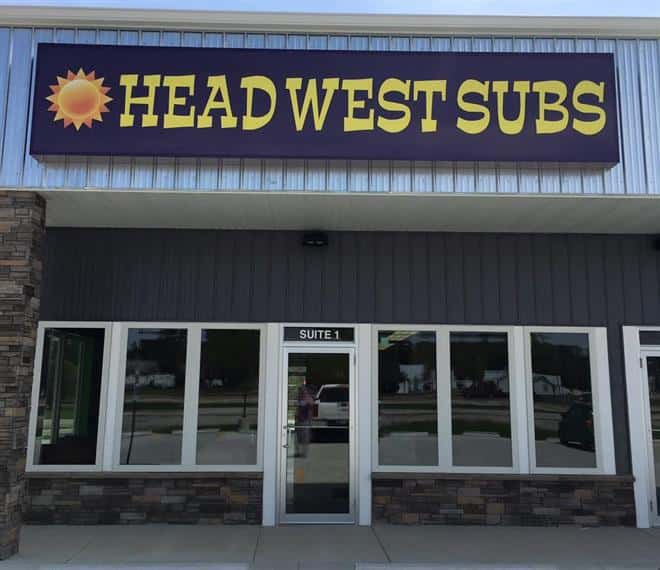Storefront Head West Subs sign over entrance