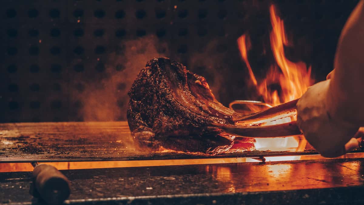Steak over a flame grill