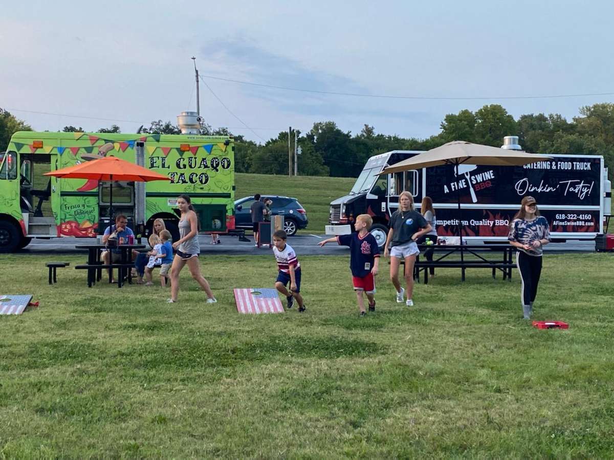 Food Trucks with families in front