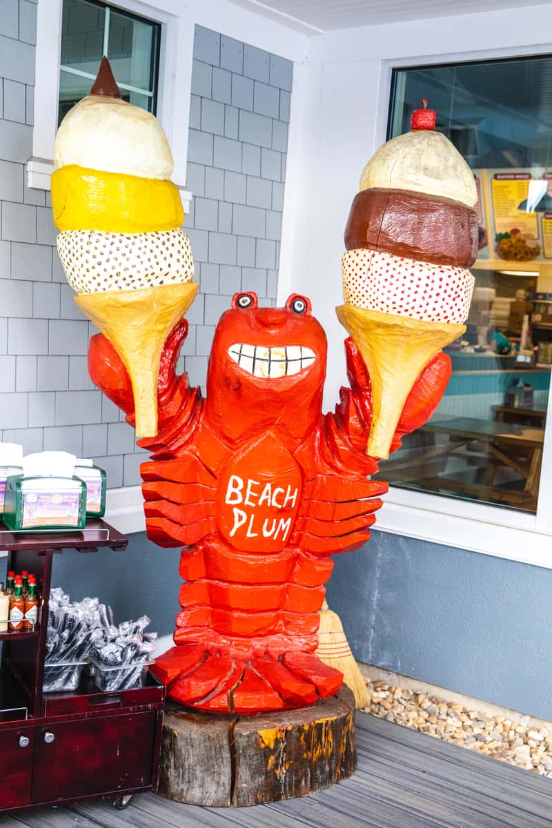 beach plum crab mascot with ice cream