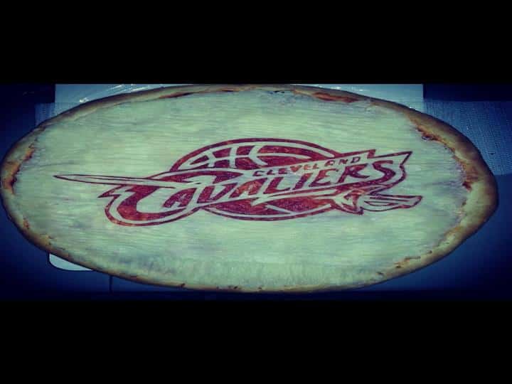 A pizza crust with clevelend cavaliers carved into it