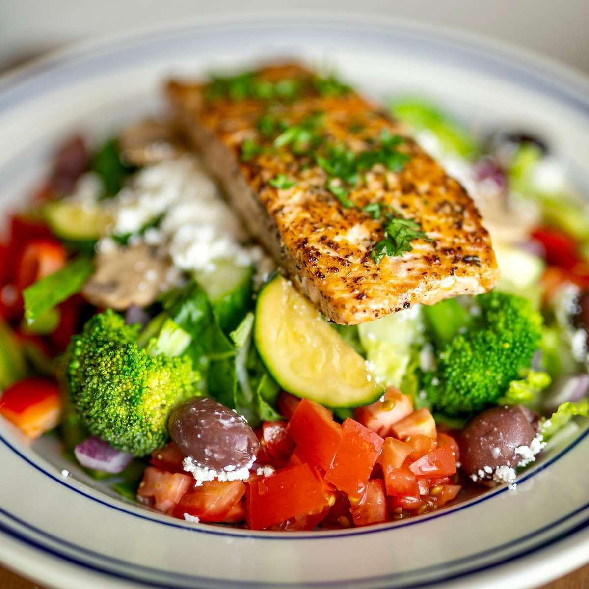  greek salad with salmon filet