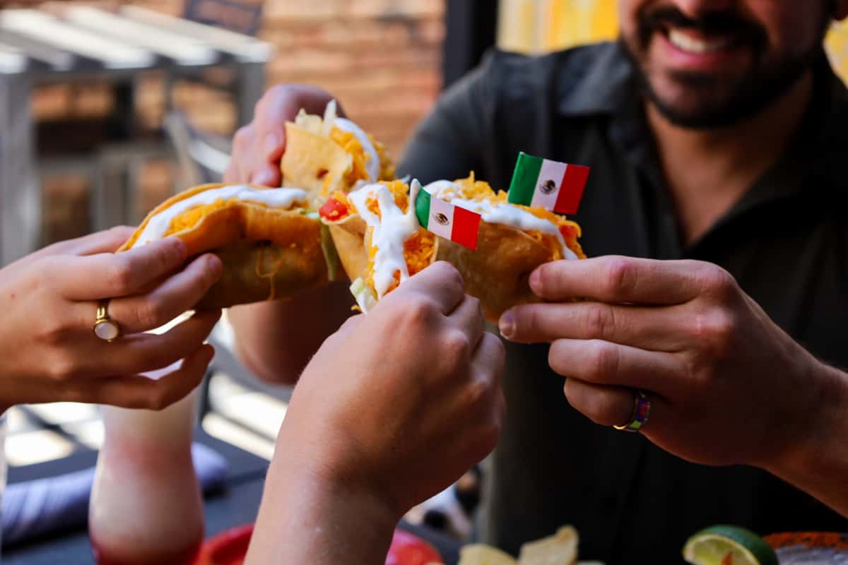 Tinga Chicken Taco Cheers with friends