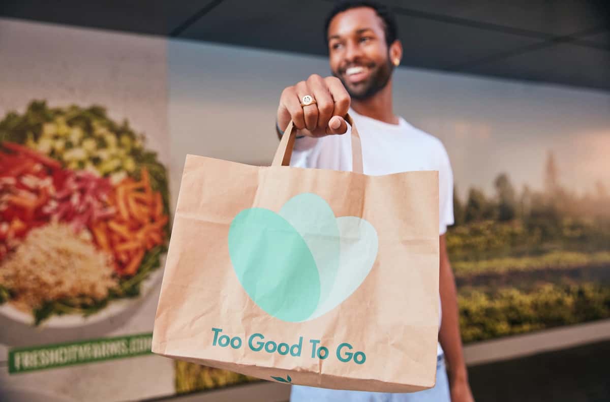 Man holding a too good to go bag