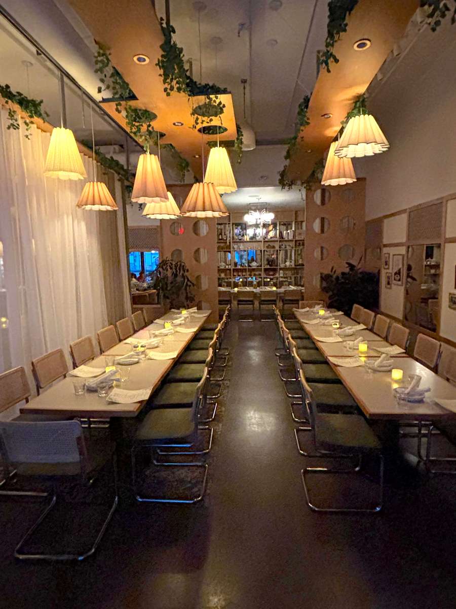 Semi-private dining room with two long tables