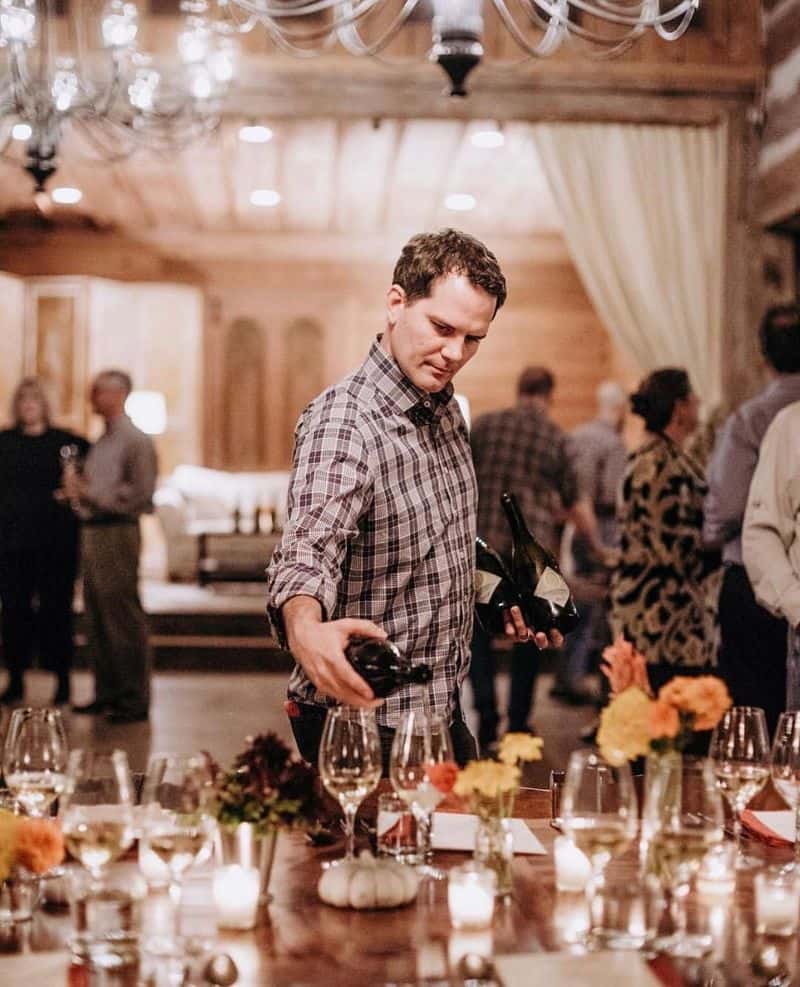 man pouring wine