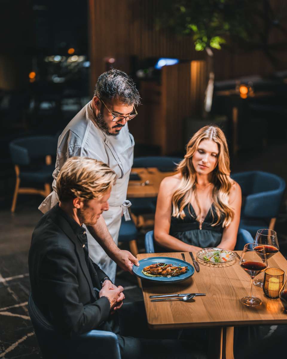 Couple enjoying a fine dining experience at 71Above restaurant Los Angeles