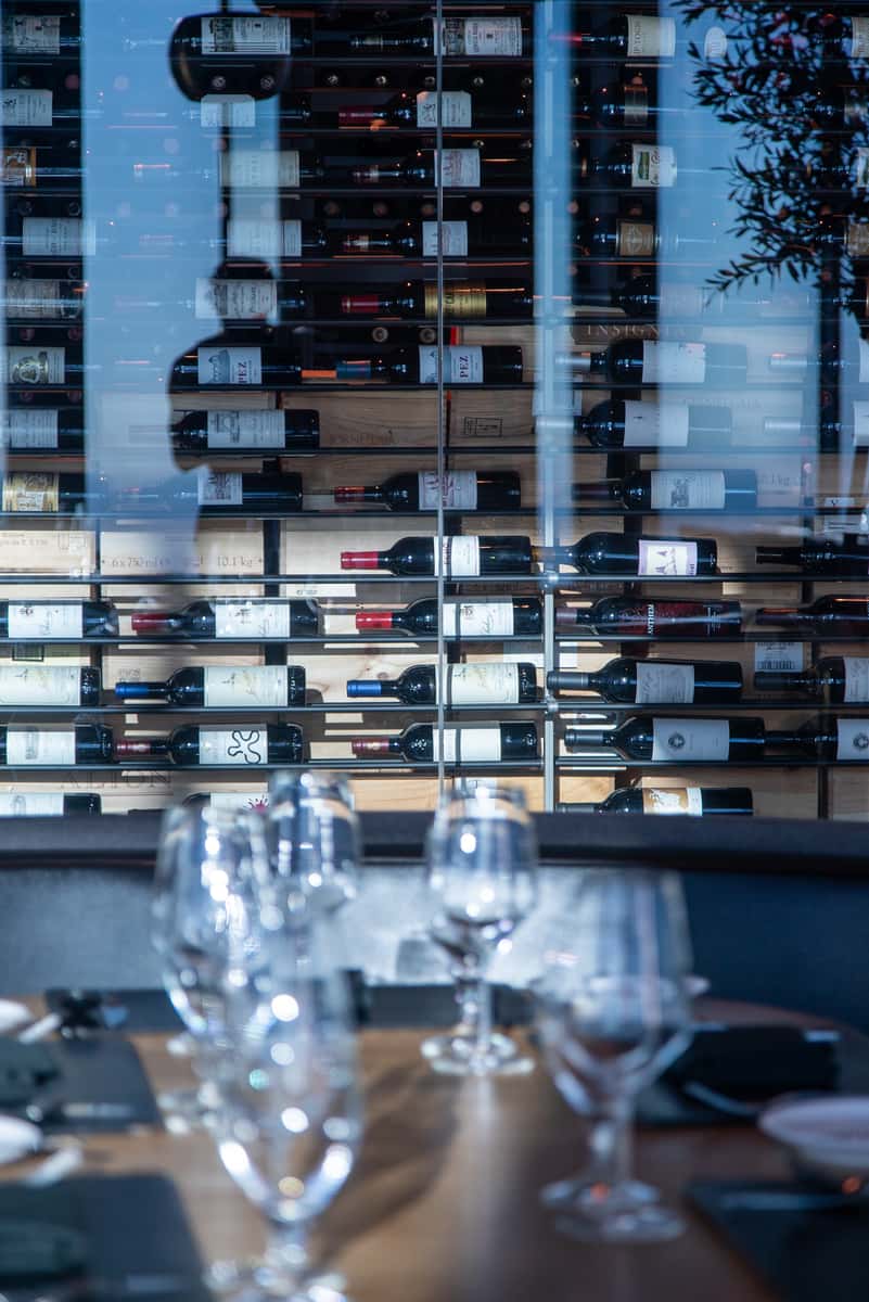 Full wine wall at 71Above displaying a global wine collection curated by Beverage Director Catherine Moral.