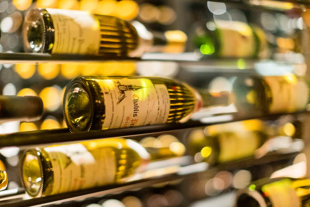 Sommelier at 71Above presenting wine selections to guests during a corporate dining event in Los Angeles.