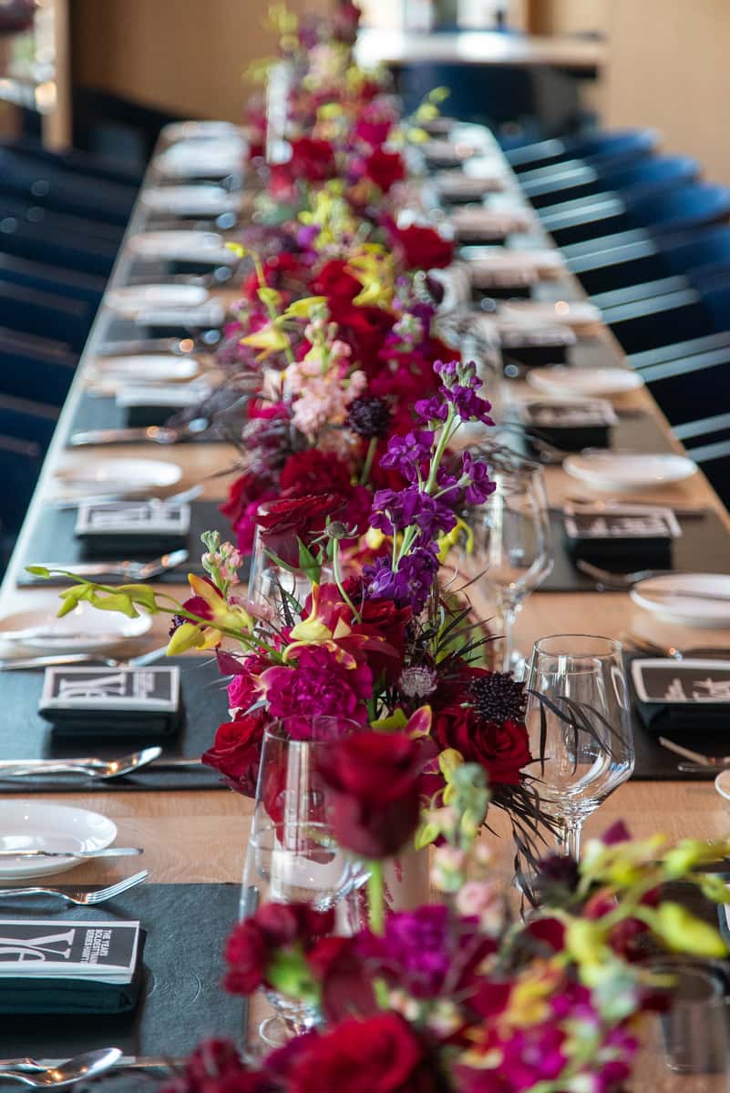Elegantly set dining table with floral arrangements at 71Above, one of the best restaurants in Downtown Los Angeles