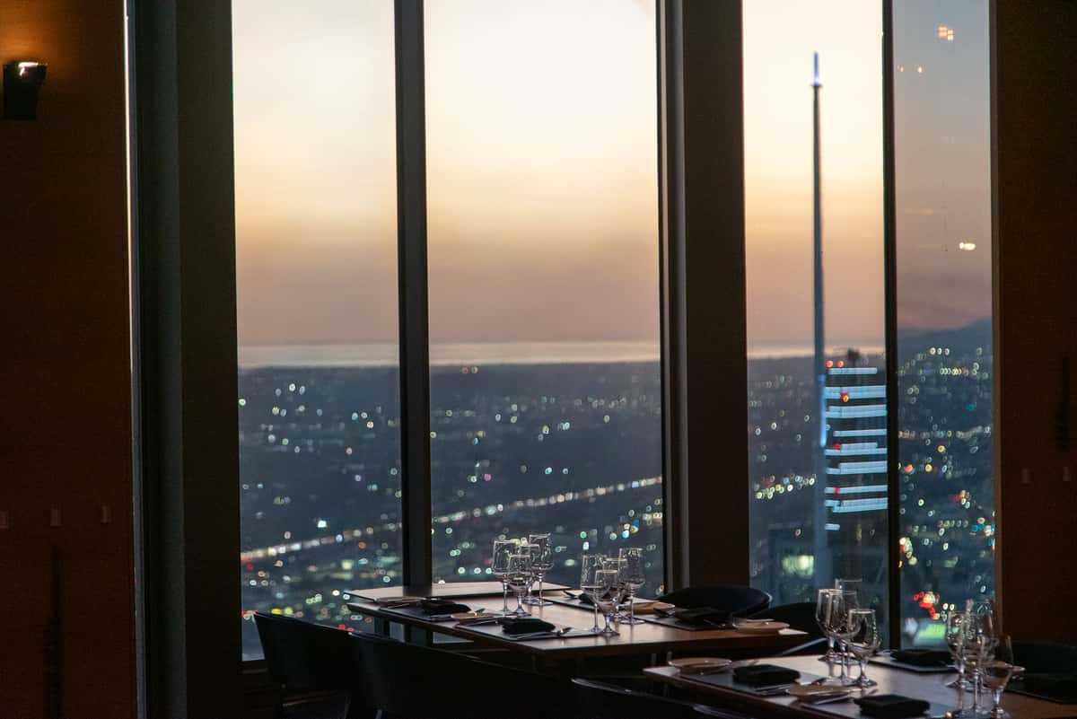 Sunset view through the floor-to-ceiling windows at 71Above restaurant in Los Angeles