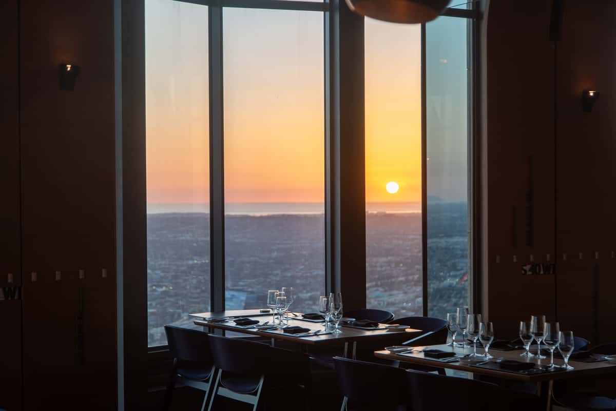 Intimate table setting at 71Above with dramatic sunset over Los Angeles