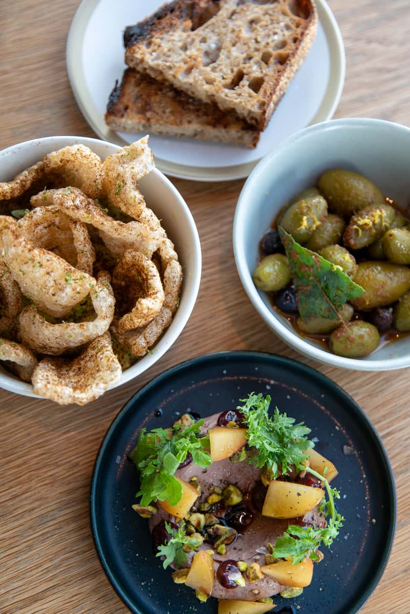 Golden Hour small plates at 71Above bar with panoramic views of the Los Angeles skyline in the background