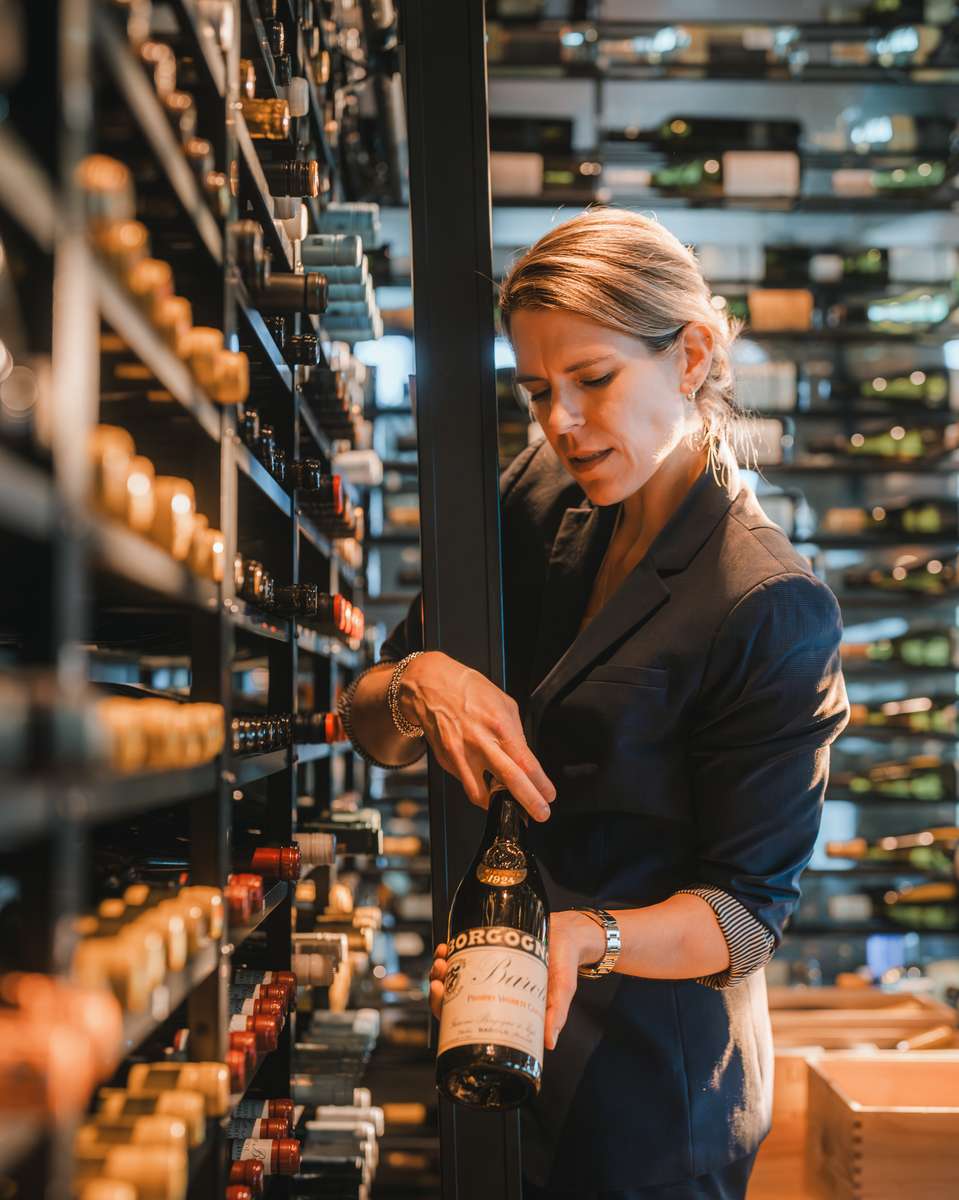 Curated wine bottles displayed in the 71Above wine room, showcasing old-world and new-world selections chosen by Beverage Director Catherine Moral.
