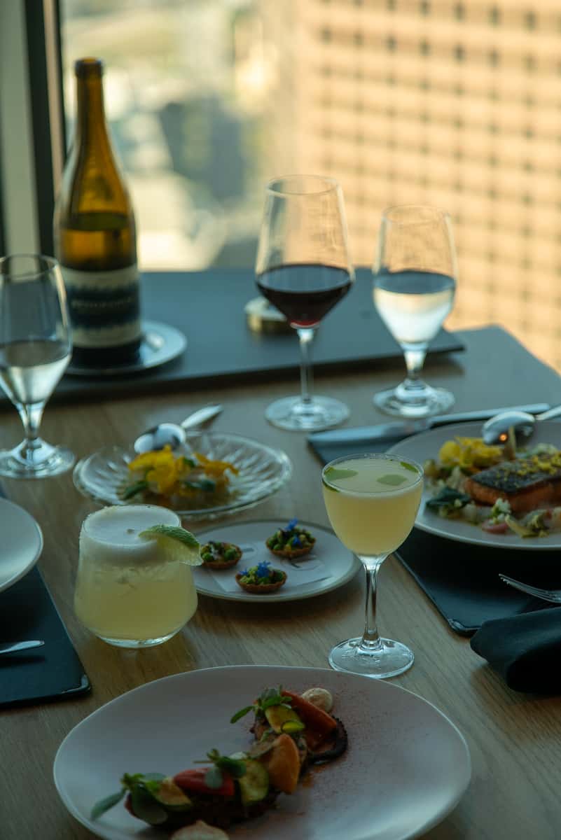 Artfully presented three-course prix-fixe dinner at 71Above, featuring seasonal ingredients