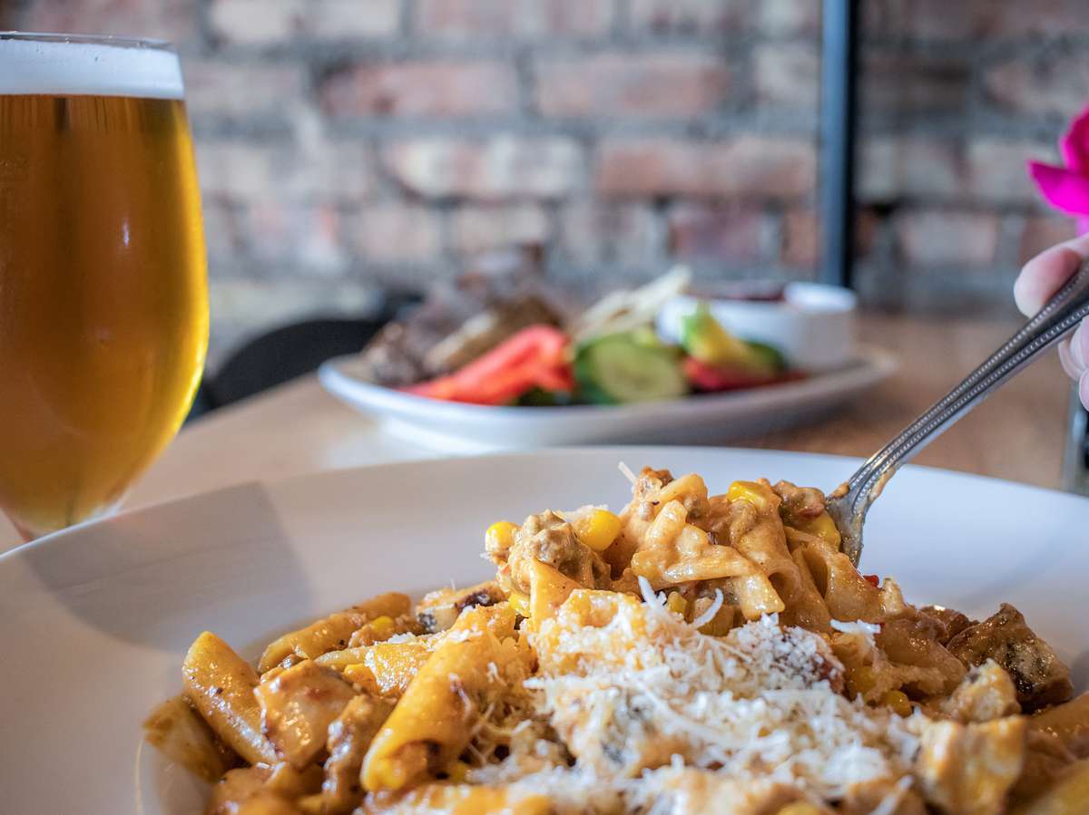 GLuten-free penne pasta tossed with a chipotle, chorizo, and sweet corn cream sauce. Topped with parmesan cheese.