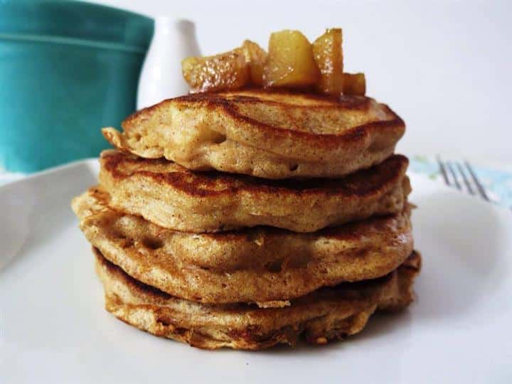 Cinnamon apple pancakes stacked on a plate