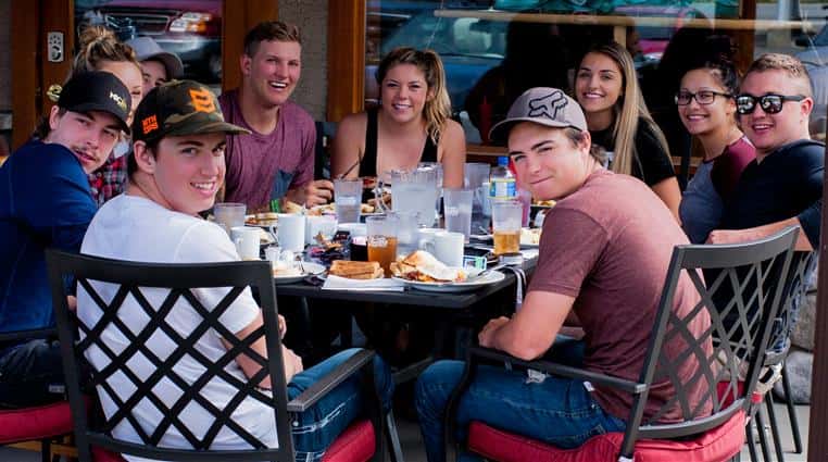 Teenagers dining on the patio at Spinnaker Cafe