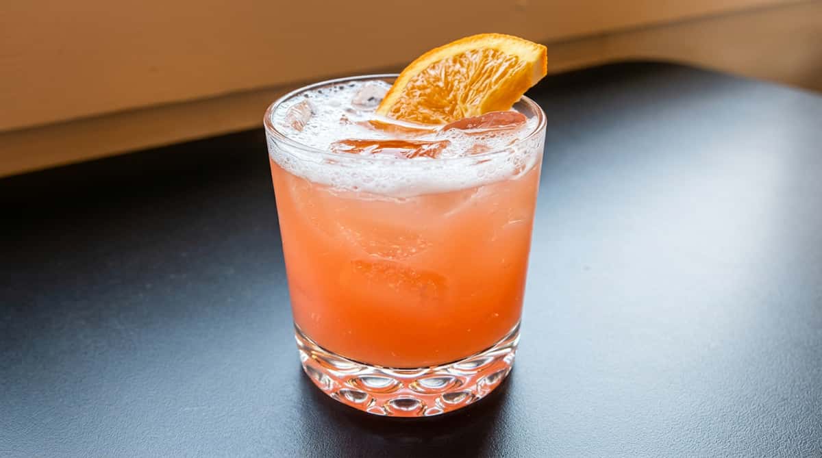 Refreshing citrus cocktail with orange garnish served at Serafini's bar in downtown Frankfort, Kentucky.