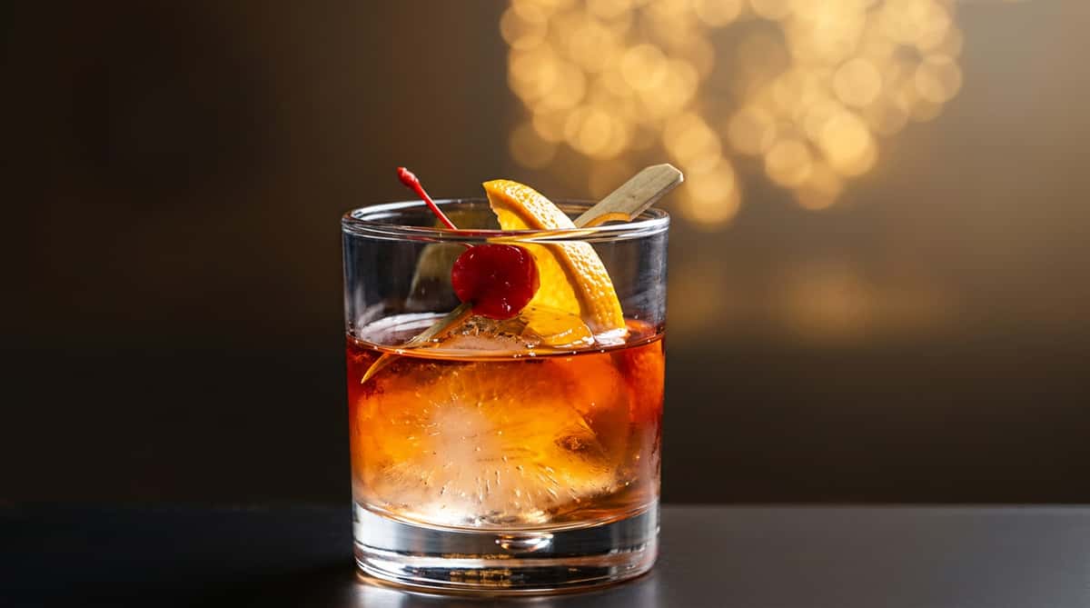 Kentucky bourbon Old Fashioned with orange peel served at Serafini, celebrating local bourbon traditions in Frankfort.