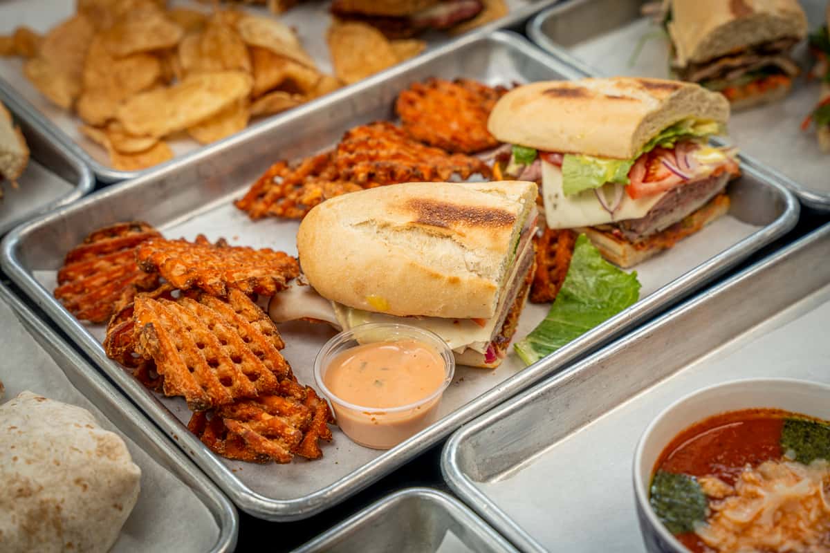 Stacked sandwich combo on a table