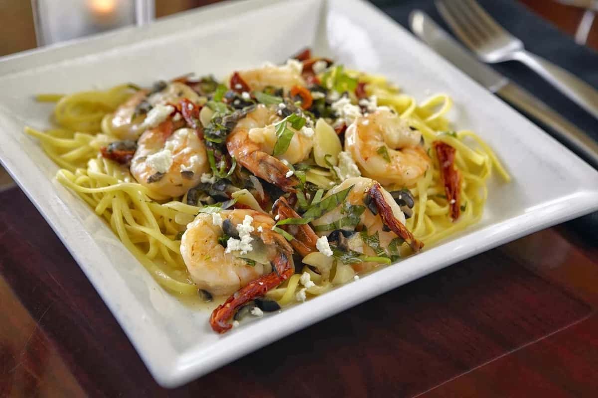 Seafood pasta with shrimp and vegetables in garlic sauce at Positano Ristorante Italiano