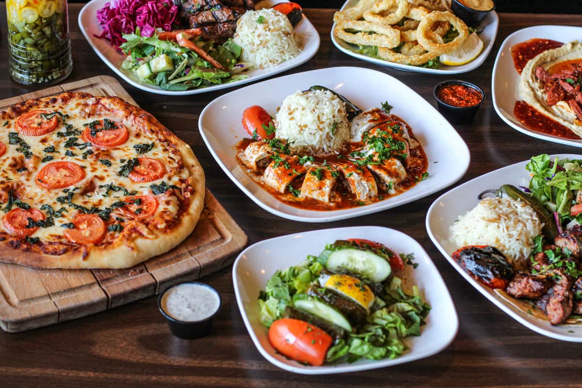 Table full of colorful Mediterranean dishes