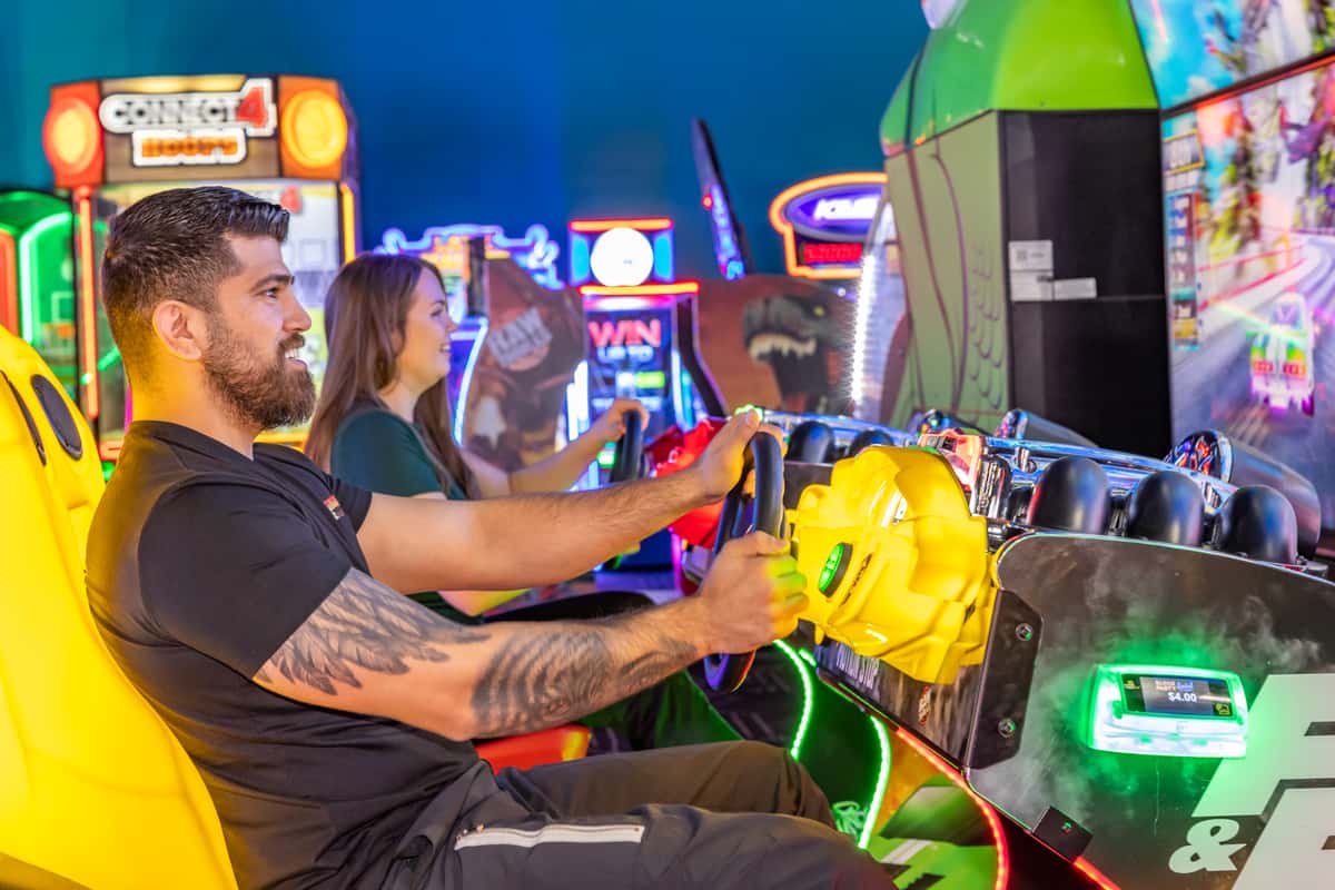 People playing an arcade game