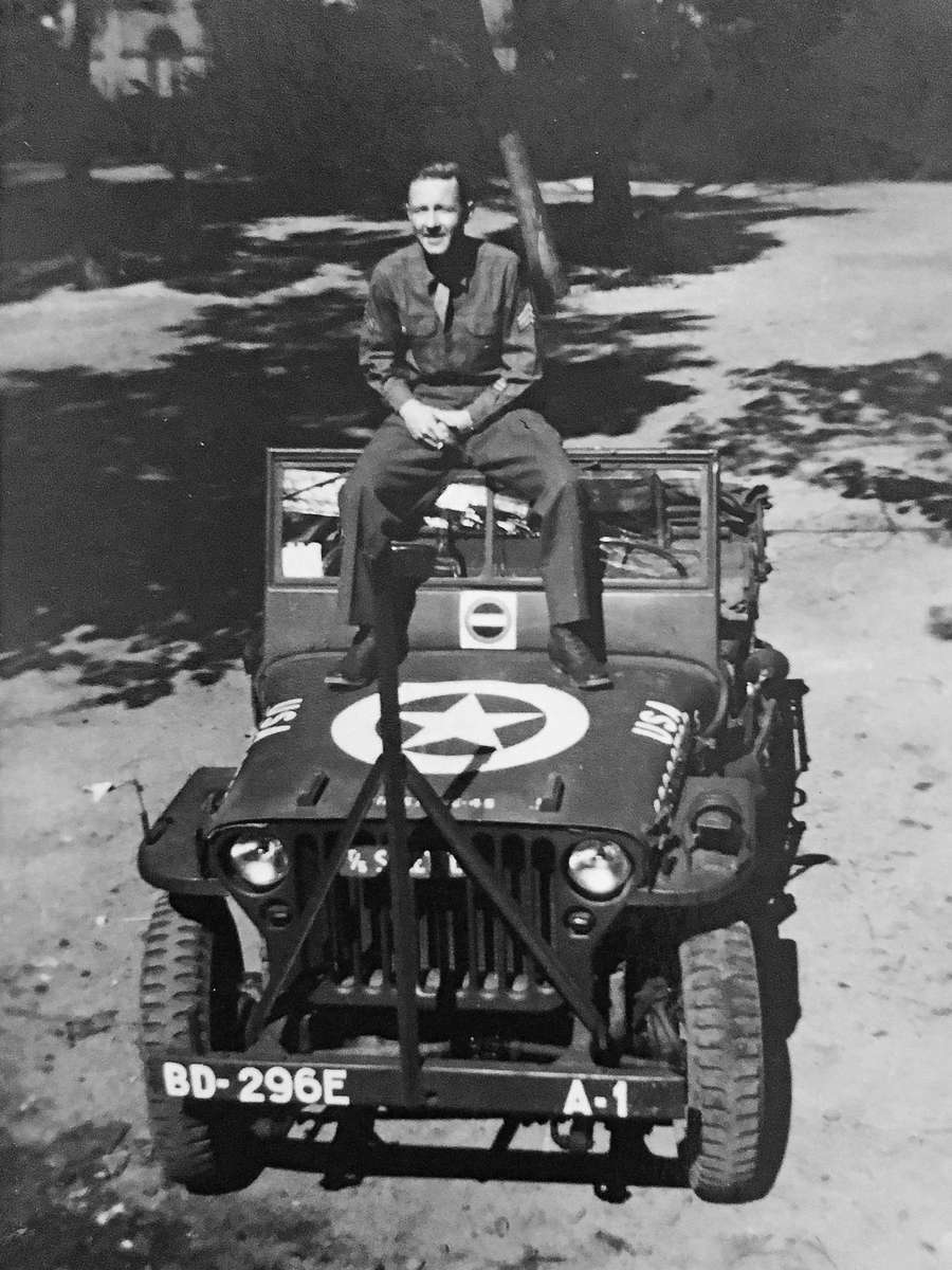 Grandfather on military vehicle