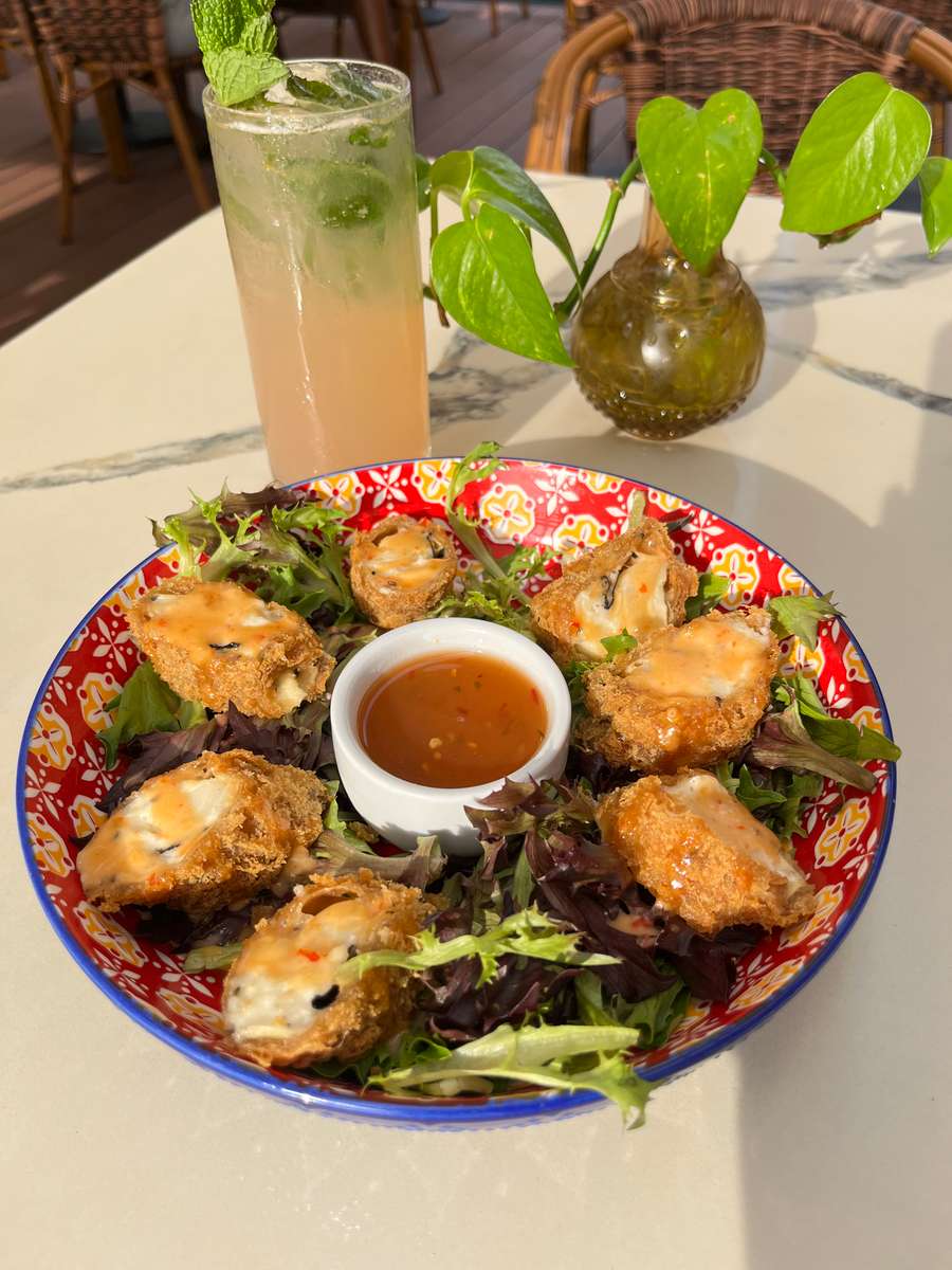 Heart of palm, cream cheese, seaweed and sesame seeds inside of a crispy tempura shell on a bed of greens, drizzled with bang bang sauce and vermicelli sauce for dipping