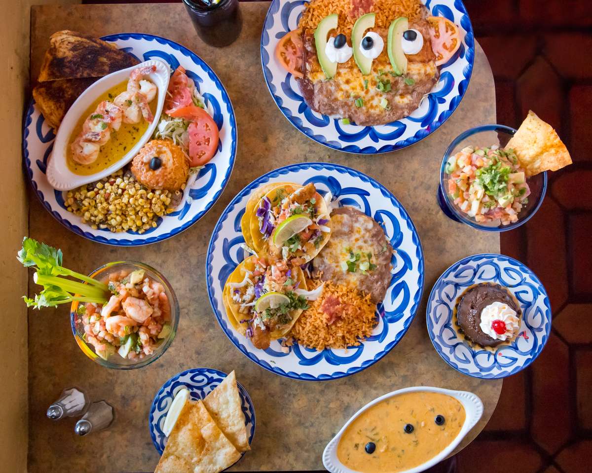 Table with various plates of food