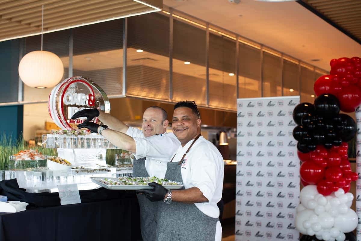 chefs setting up raw bar