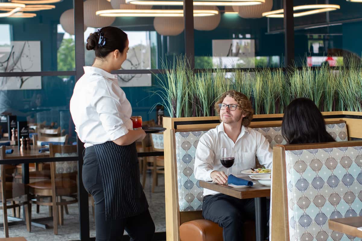Server greeting a table