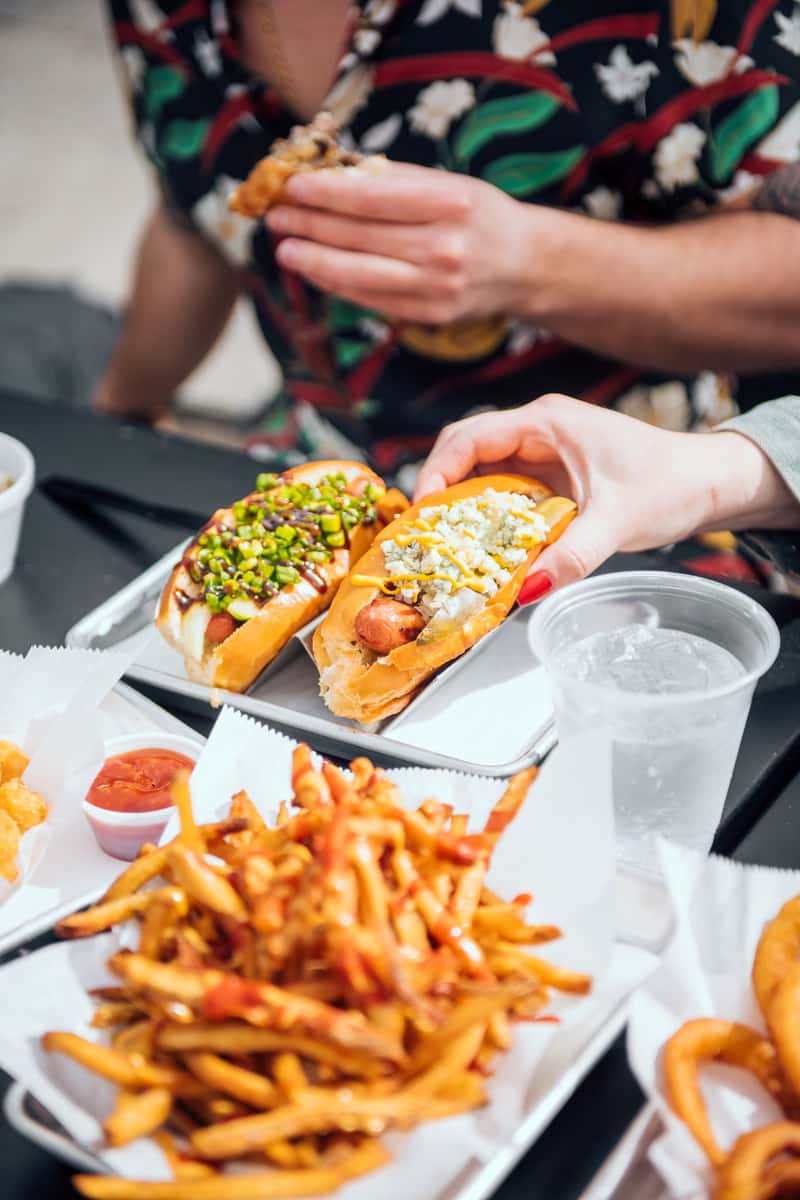 hot dogs and fries on a table