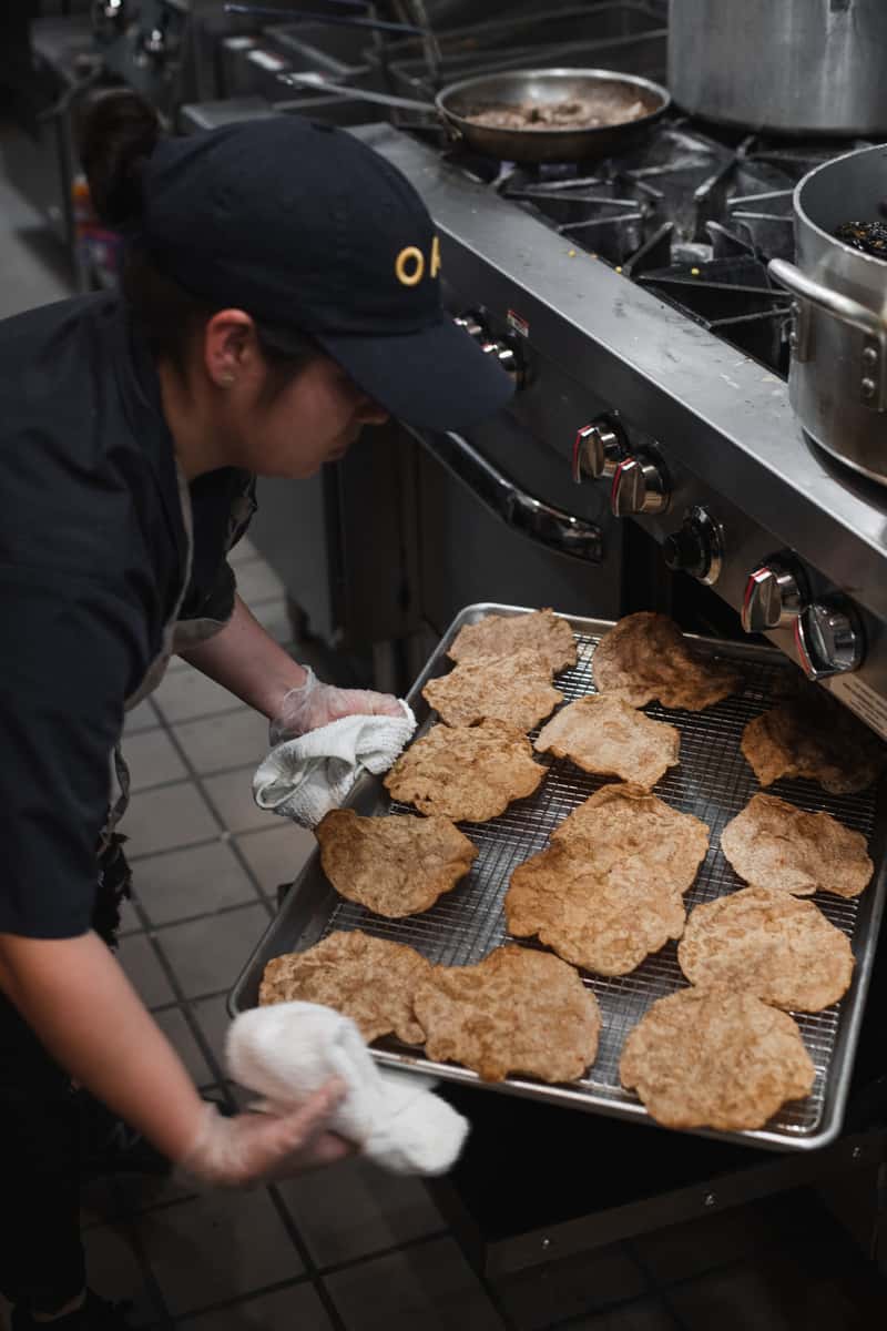 staff with corn tortillas