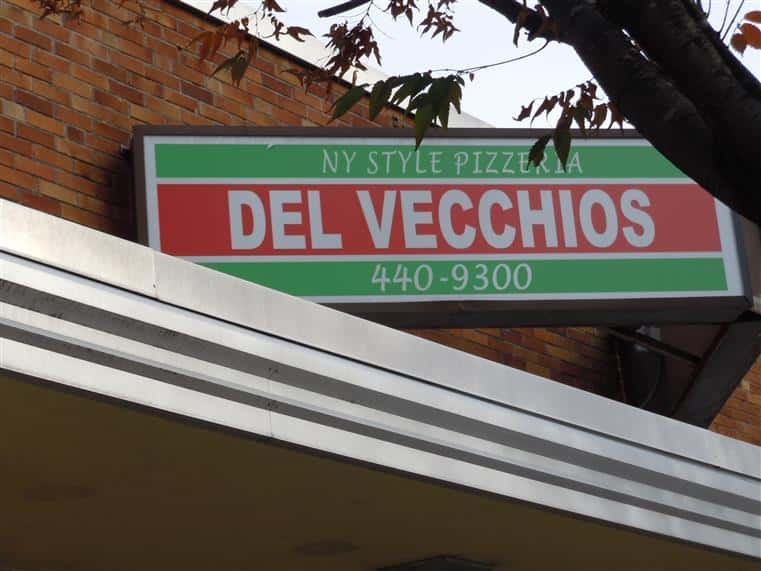 Del Vecchios sign on building - New York Style Pizzeria, Del Vecchios. 440-9300
